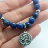 bracelet lapis lazuli facettes aa breloque arbre de vie acier inox
